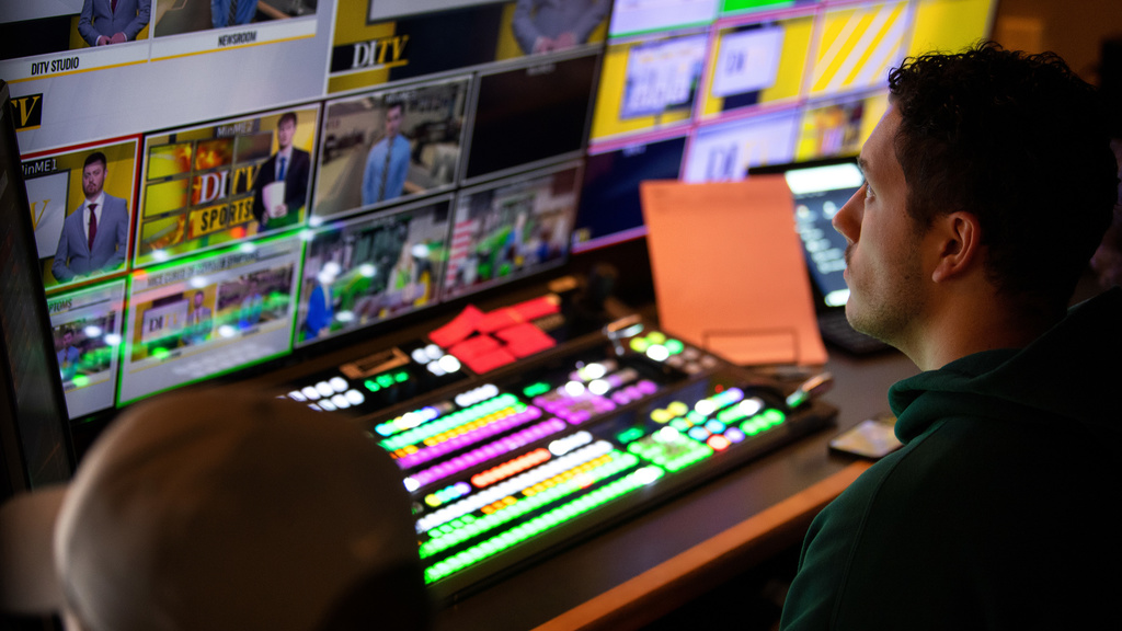 Students working behind-the-scenes of a broadcast.