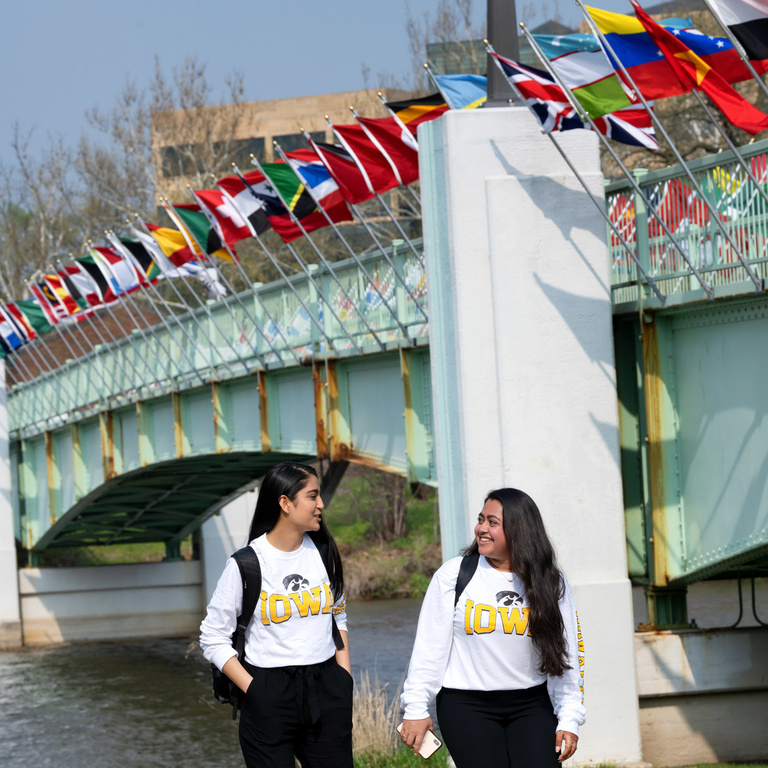 Students walking by International Flag Bridge