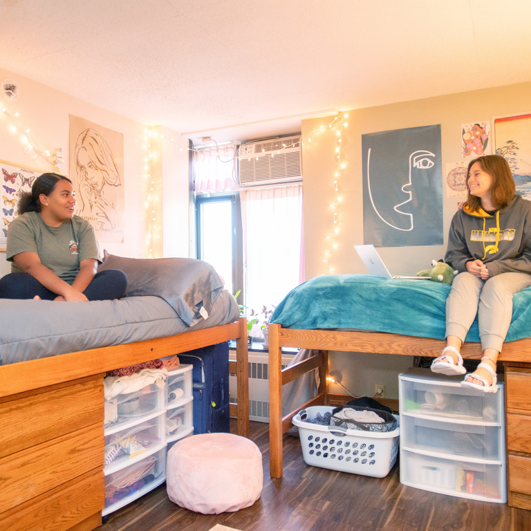 Students sitting in their residence hall room
