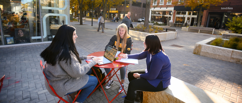 Students sitting in the Ped Mall