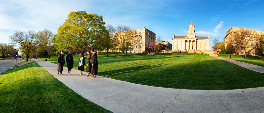 Graduates standing on pentacrest