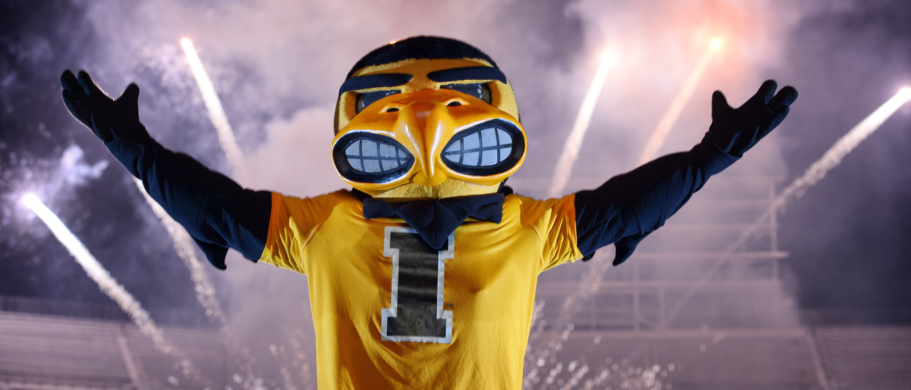Herky with fireworks behind him.