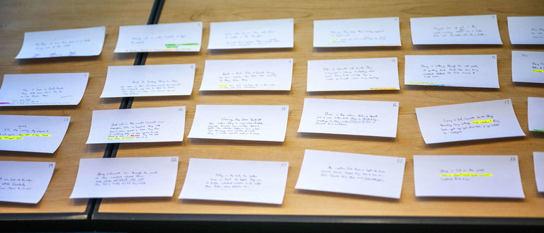 Storyboarding index cards on table