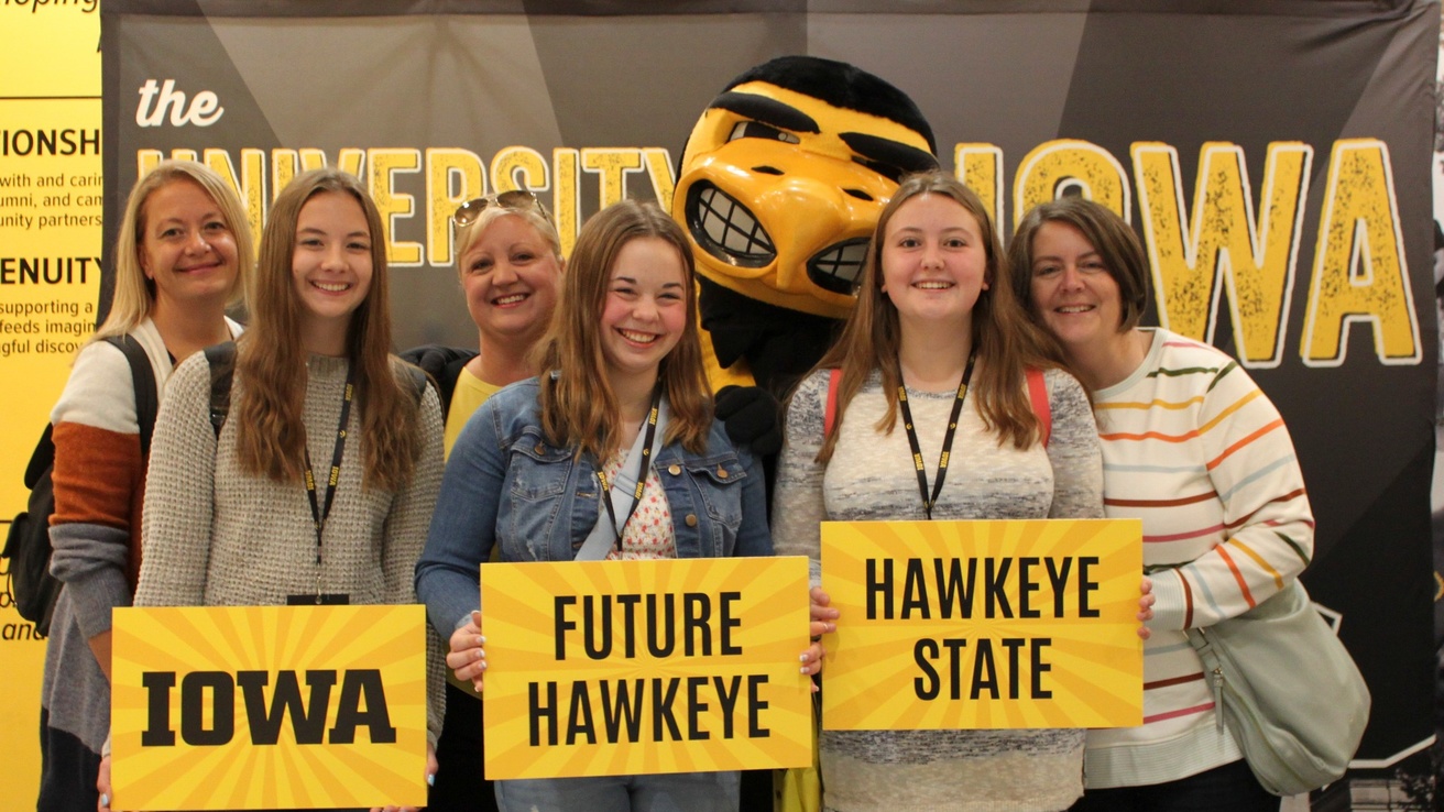 Hawkeye Visit Day family picture with Herky.